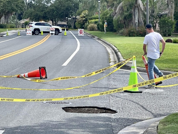 Barricades and cones were set up to keep traffic away from the sinkhole on Canal Street