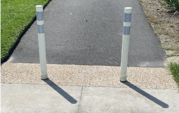 Bollards would be added to prevent golf cart access to the walking trail and park areas. Bollards would be added to prevent golf cart access to the walking trail and park areas.