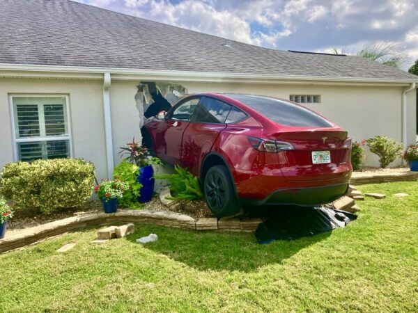 A Villager crashed her brand new Tesla into a neighbor s home on Tuesday afternoon. A Villager crashed her brand new Tesla into a neighbor s home on Tuesday afternoon.
