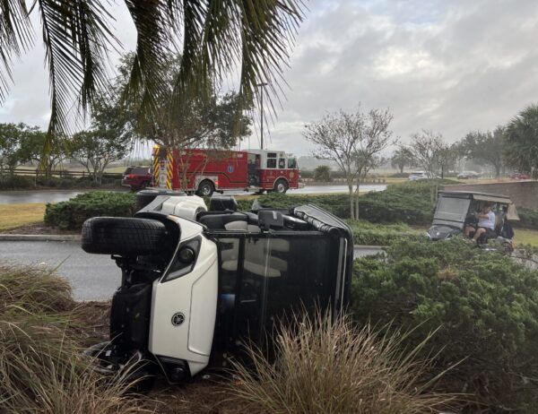 A person who had been traveling in this golf cart was transported from the scene ofa rollover accident A person who had been traveling in this golf cart was transported from the scene ofa rollover accident