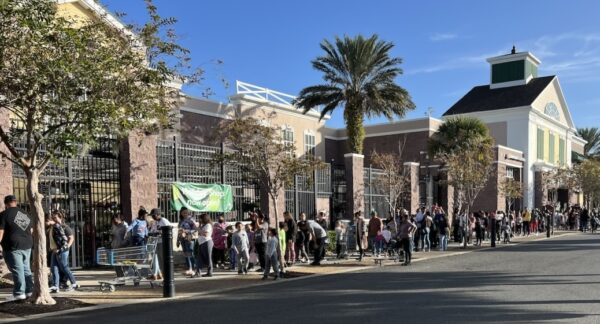 Children and their families began lining up the shopping event well before 9 00a.m. Children and their families began lining up the shopping event well before 9 00a.m.
