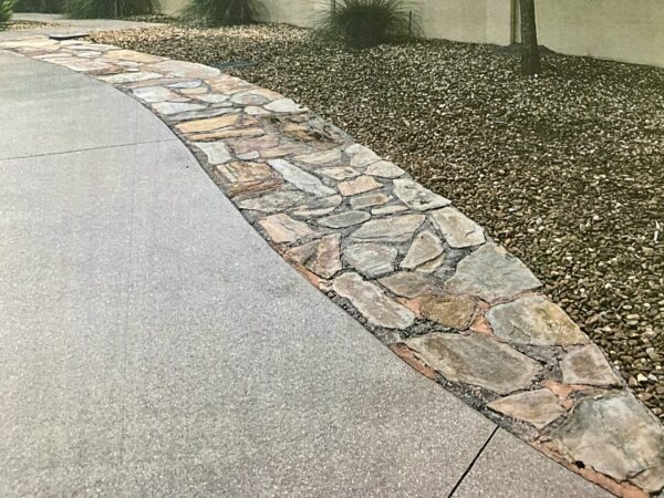 This driveway at 3918 Torch Lake Drive in the Village of Antrim Dells was modified without approval from the Architectural Review Committee This driveway at 3918 Torch Lake Drive in the Village of Antrim Dells was modified without approval from the Architectural Review Committee