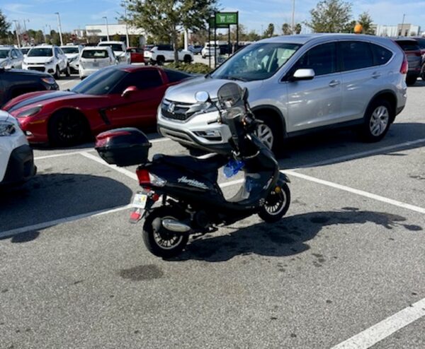 This little scooter needed a full parking spot at a time of year when parking is at a premium; This little scooter needed a full parking spot at a time of year when parking is at a premium;