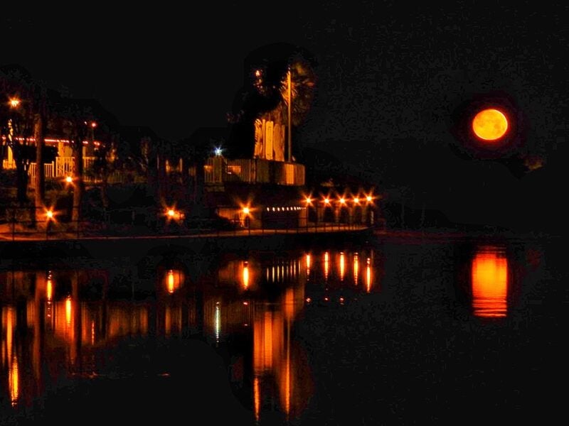 Full moon setting near the Waterfront Inn at Lake Sumter Landing