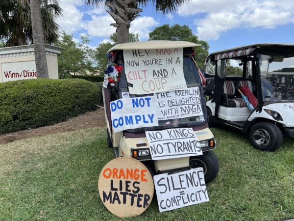 Many protesters covered their carts with signs urging people to resist the attack on democracy as well as the acctions of Musk as he cuts staffing at the Social Security Adminstration. Many protesters covered their carts with signs urging people to resist the attack on democracy as well as the acctions of Musk as he cuts staffing at the Social Security Adminstration.