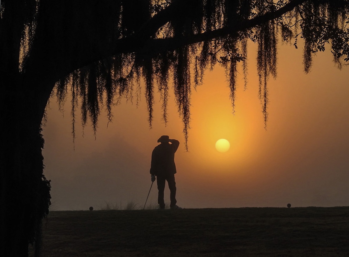 Early morning golfer at Briarwood Executive Golf Course Early morning golfer at Briarwood Executive Golf Course