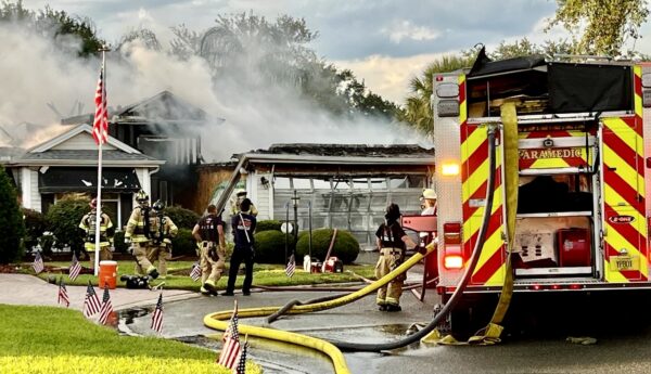 Flames erupted from the house as the result of an apparent lighting strike Flames erupted from the house as the result of an apparent lighting strike