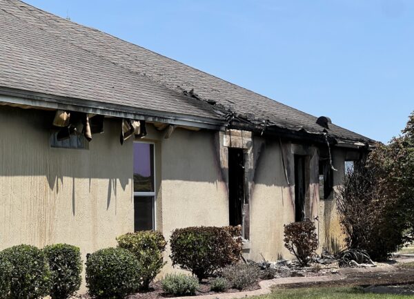 Scorch marks and damage was visible as the result of a fire at this home in the Village of Charlotte Scorch marks and damage was visible as the result of a fire at this home in the Village of Charlotte