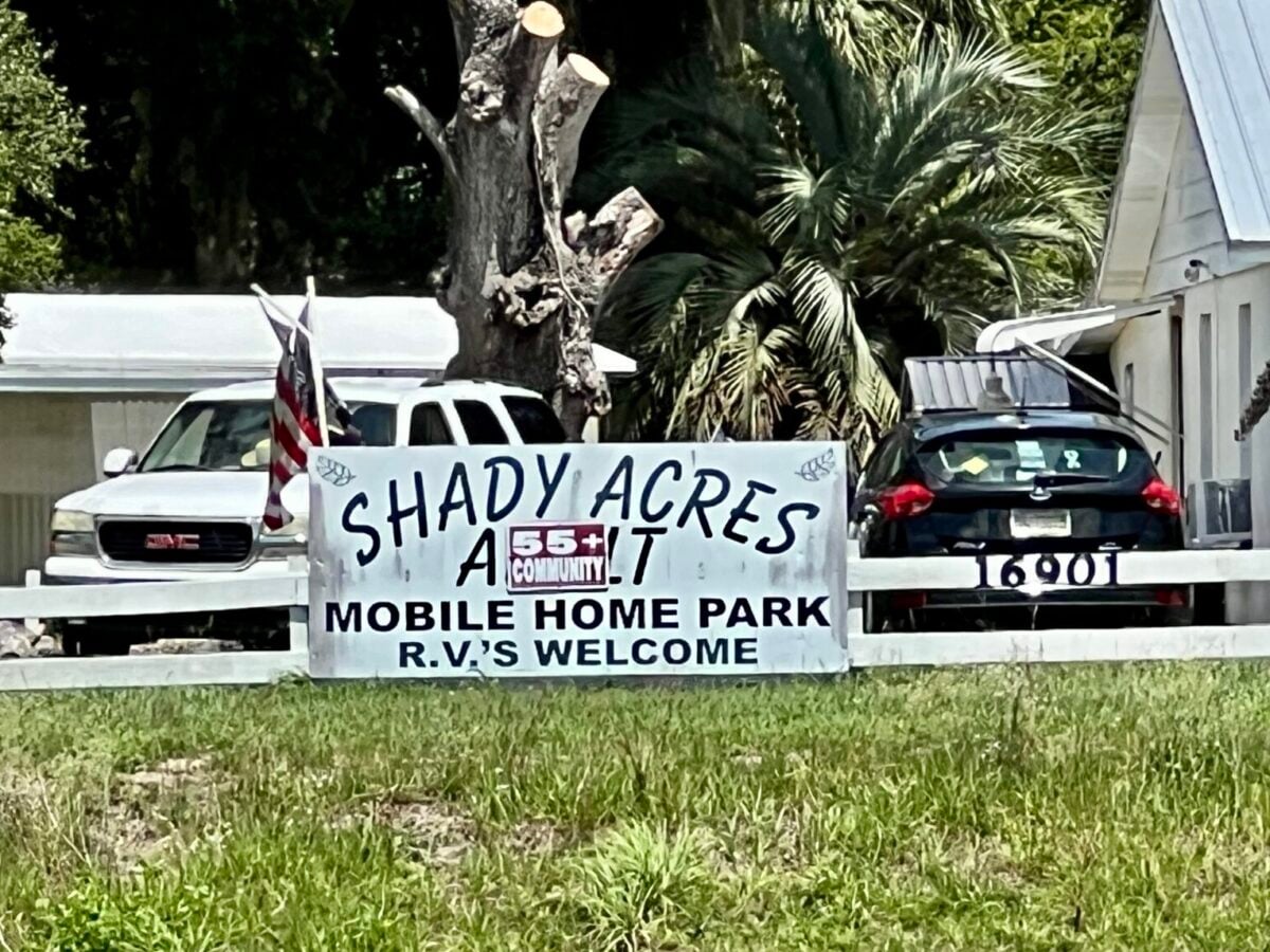 Jealous woman in pickup allegedly runs motorcycle off road near mobile home park
