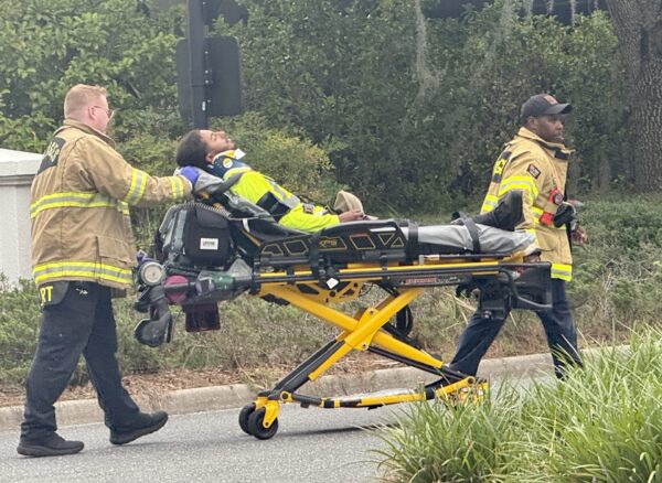 The injured landcaper was taken away on a stretcher by members of The Villages Public Safety Department. The injured landcaper was taken away on a stretcher by members of The Villages Public Safety Department.