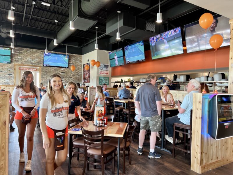 Hooters waitresses greeted customers to the chains newest restaurant.