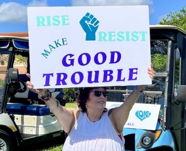 Sandra Dupree who lives in the Village Chula Vista held her signs high Sandra Dupree who lives in the Village Chula Vista held her signs high