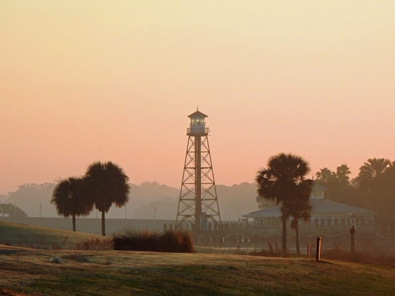 Dawn breaking behind the lighthouse at Lake Sumter