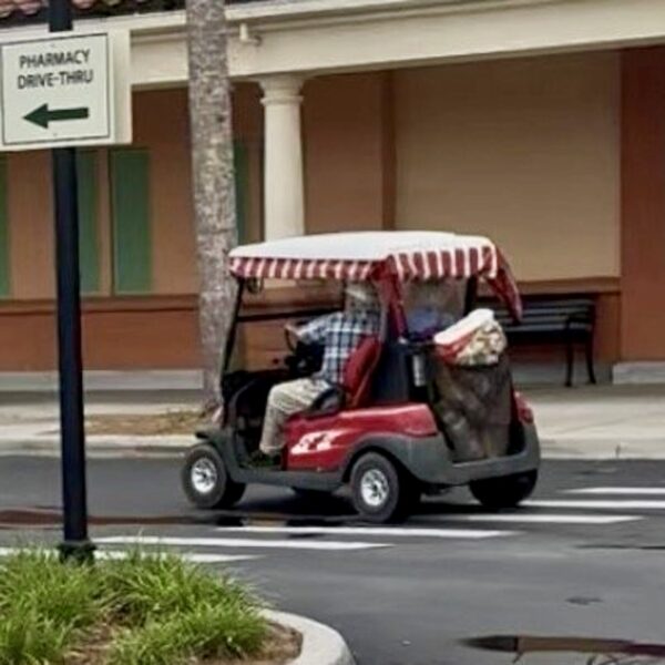 The man was in a red golf cart at Publix at Spanish Plaines The man was in a red golf cart at Publix at Spanish Plaines