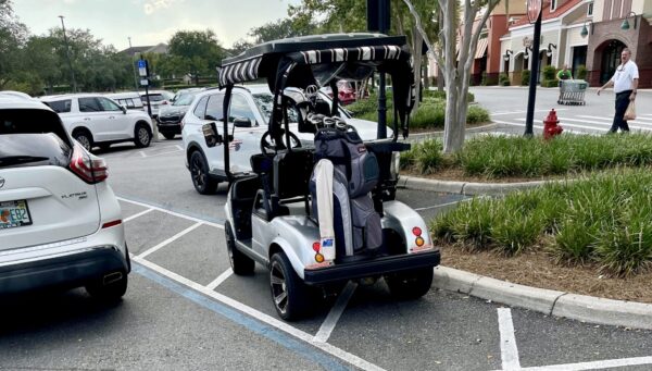 This golf cart driver was feeling entitled by using a handicapped accommodation zone at Southern Trace Plaza This golf cart driver was feeling entitled by using a handicapped accommodation zone at Southern Trace Plaza