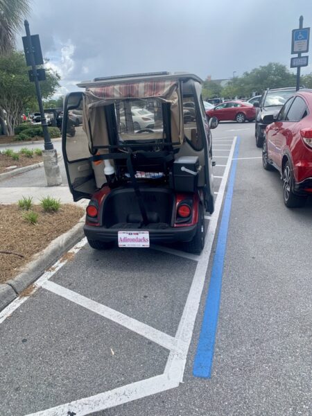 This golf cart was parked in a handicapped accommodation zone at Colony Plaza This golf cart was parked in a handicapped accommodation zone at Colony Plaza