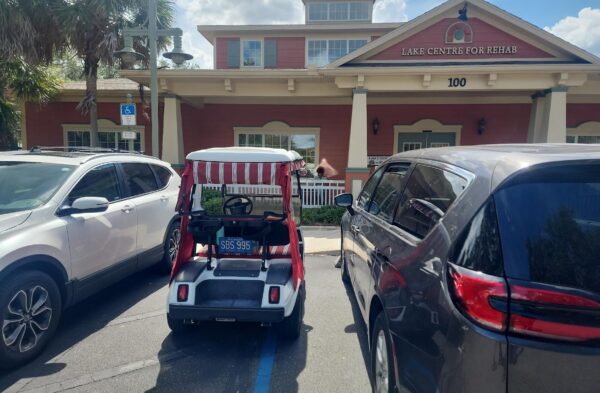 A Villager using a walker was blocked of the space he needed when this golf cart parked in a handicapped accommodation zone A Villager using a walker was blocked of the space he needed when this golf cart parked in a handicapped accommodation zone