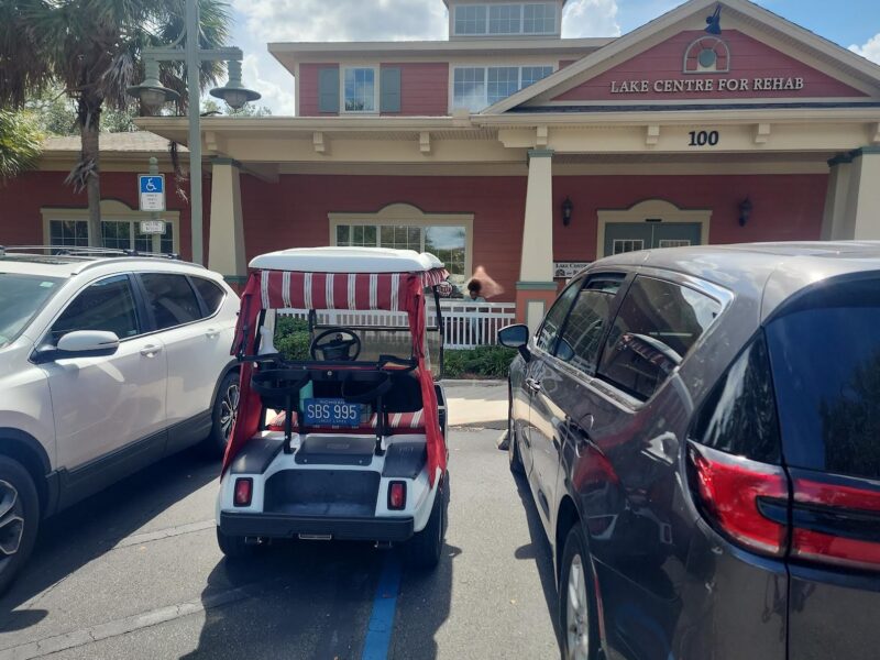 A Villager using a walker was blocked of the space he needed when this golf cart parked in a handicapped accommodation zone
