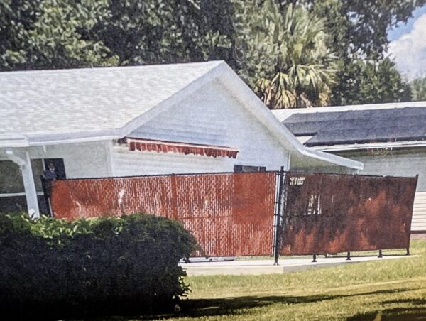 A complaint about fence led to the discovery of the unapproved patio A complaint about this fence led to the discovery of the unapproved patio