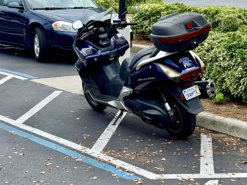 This motorcycle was parked in a handicapped accommodation zone at Pinellas Plaza copy