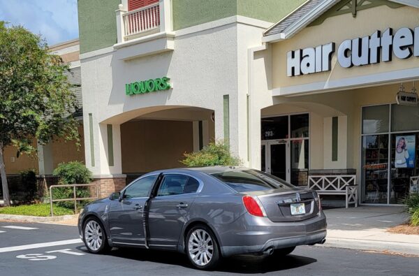 Was this motorist stopping for a quick haircut or was it a beer run? Was this motorist stopping for a quick haircut or was it a beer run?