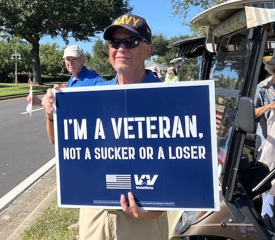 A veteran held a sign with an important message A veteran held a sign with an important message