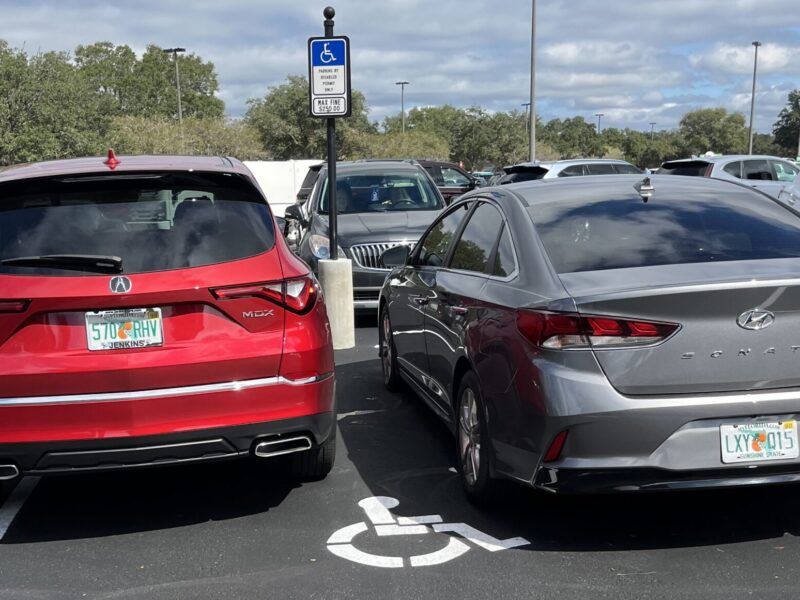 These cars, with no handicapped license plates and no visible handicapped placard, were crammed together in a handicapped parking spot