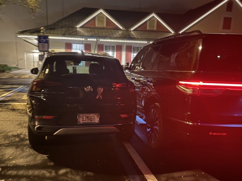 The driver of the vehicle at right returned to find a parking job that was too close for airport