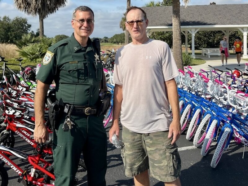 Captain Bob Siemerand Sumter Landing Bicycle Club member Frank Miller worked through out the morning getting bikes ready for Christmas