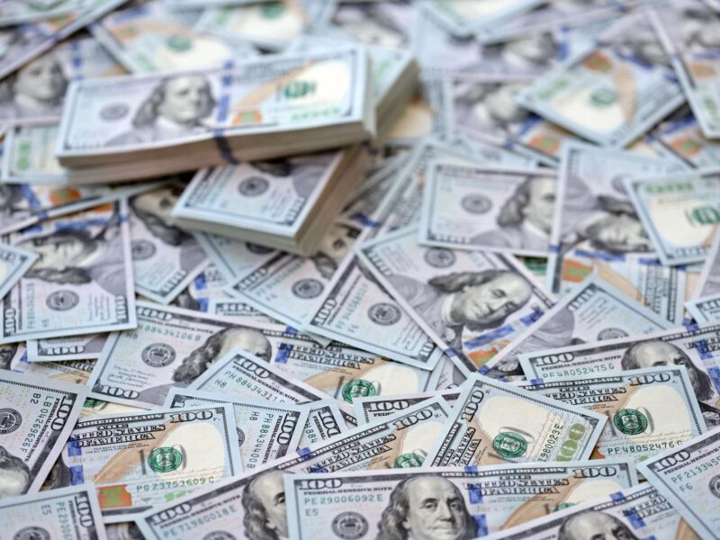 Pile of one hundred dollar bills