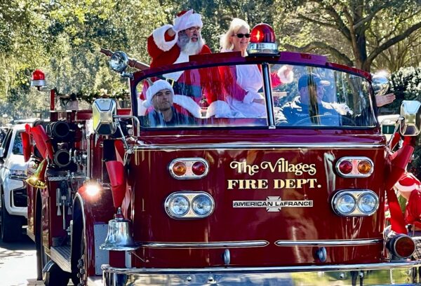 Santa and Mrs. Claus arrived courtesy of a classic fire engine from The Villages Public Safety Department