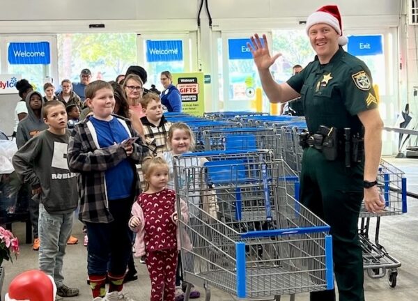 Sgt. Adam Dodge matched the children with a deputy for an exciting holiday shopping experience