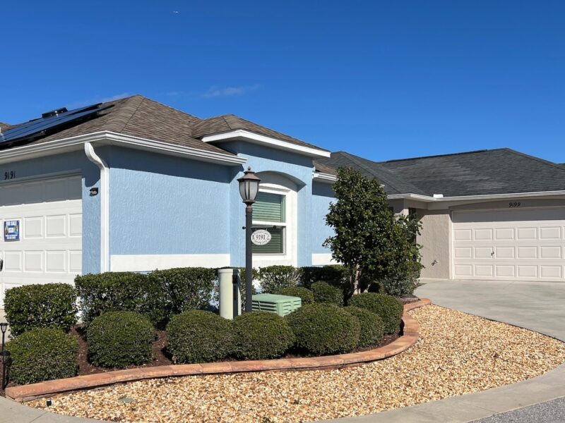 The bright blue paint job stands out at 9191 SE 166th Sprung Lane in the Phillips Villas