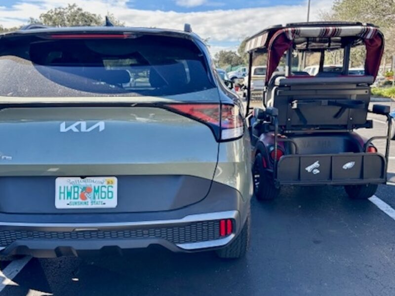This car and golf cart were squeezed in together at the Mulberry Grove Recreation Center