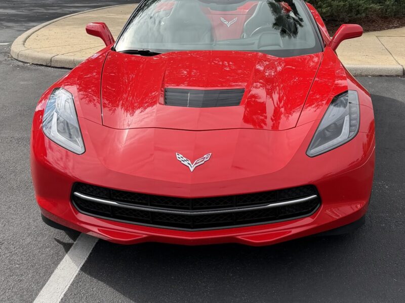 This red Corvette was parked over the line at Mallory Hill Country Club