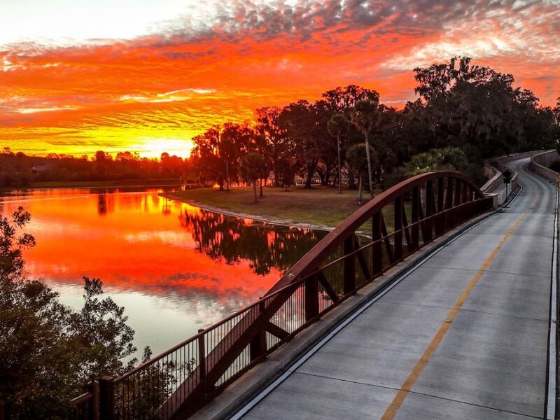 Fiery sunrise over Brownwood Bridge in The Villages