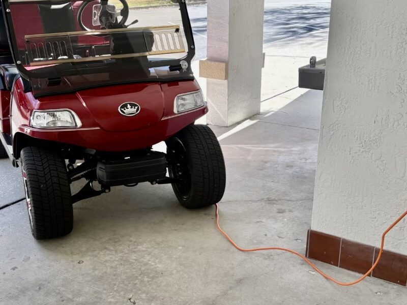 Golf cart charging up at postal station
