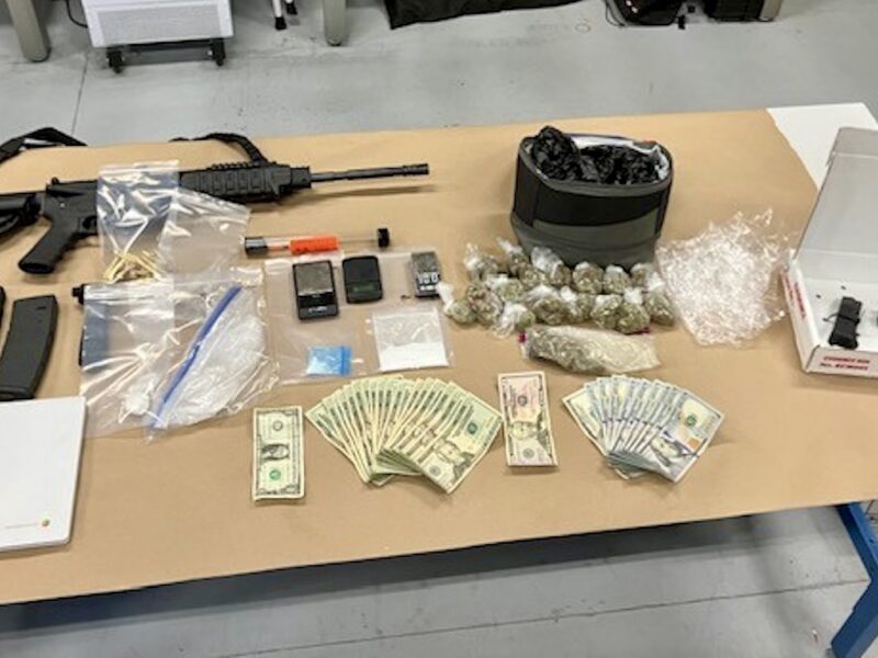 Guns, cash and drugs were foudn in the motel room at the time of the arrests