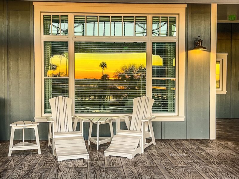 Sunrise behind Lake Okahumpka Recreation Center reflecting on window