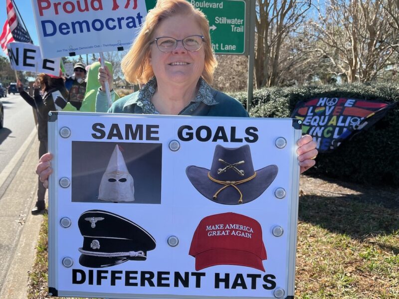 Taren Durham, a Summerfield resident joined the protest with a sign she made because Isupport democracy.