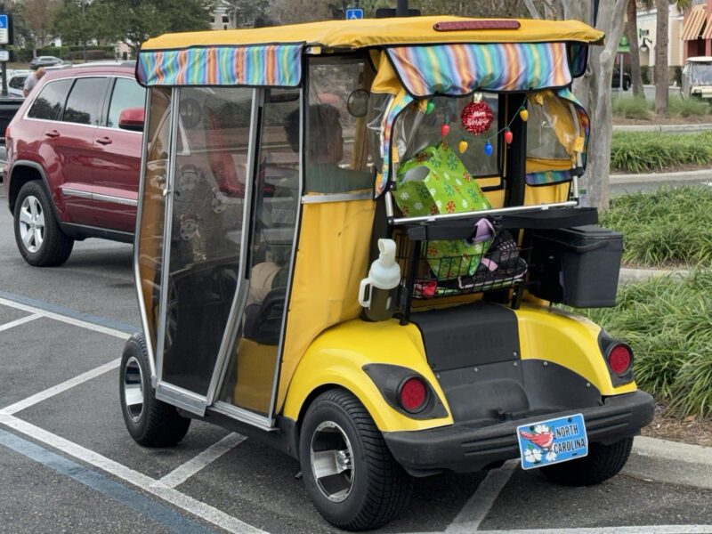 This golf cart was parked in the handicapped accommodation