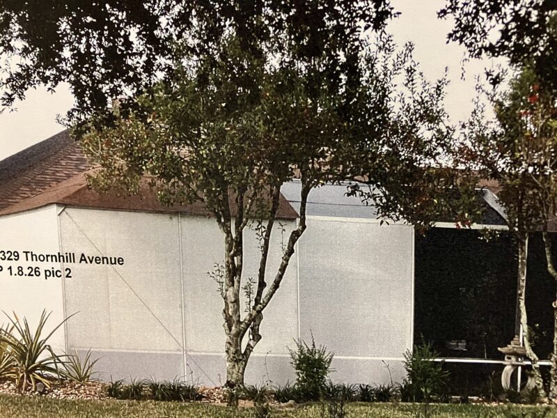This photo, submitted as evidence by Community Standards, shows the lanai and its out-of-compliance roof.