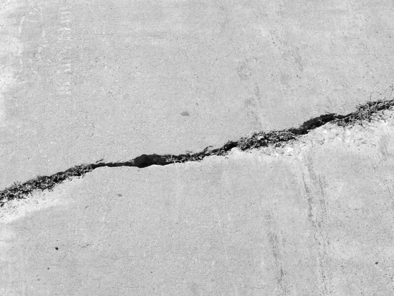 A man has filed a lawsuit against a California-based company over an alleged trip-and-fall incident caused by a cracked sidewalk. (Not pictured)