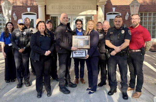 Stacey Wrightam receives a plaque in honor of her being named the 2025 Employee of the Year. She is surrounded by her colleagues. Stacey Wrightam receives a plaque in honor of her being named the 2025 Employee of the Year. She is surrounded by her colleagues.