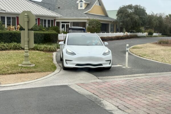 The driver of this white Tesla took a drive in the golf cart lane across the Morse Boulevard bridge at Lake Sumter. The driver of this white Tesla took a drive in the golf cart lane across the Morse Boulevard bridge at Lake Sumter.