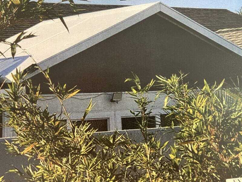 This home at 456 Gilson Loop in the Village of St. Catherine has a non compliant white metal roof