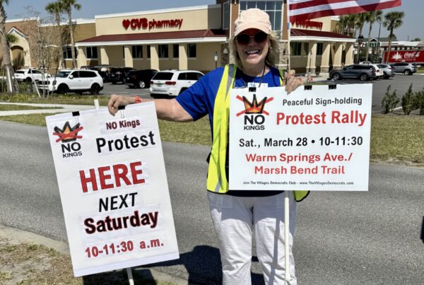 Cheryl Franson held up signs to promote the upcoming No Kings Rally 2 Cheryl Franson held up signs to promote the upcoming No Kings Rally 2
