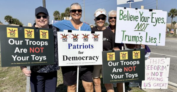 Four gals protesting