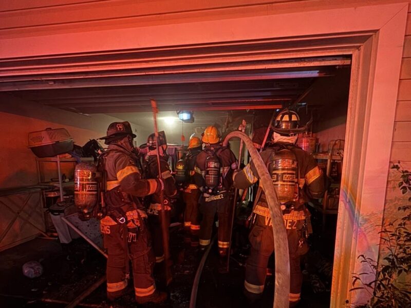 Marion County Fire Rescue firefighters in the garage.