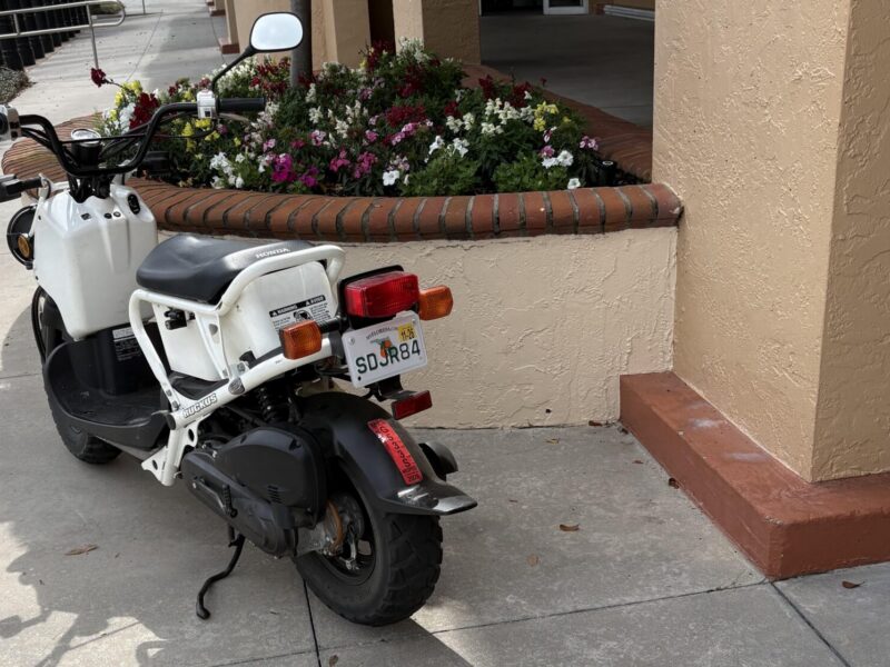 The person riding this scooter found some special sidewalke parking at La Plaza Grande